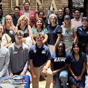 A large group of club families and Midshipmen gathered together, June 2026